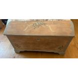 A domed wooden chest with wrought iron painted handles (H70cm W132cm D64cm)