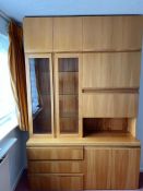 A large wall unit consisting of three drawers and two cupboards to base, a drink cabinet and two