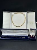 An 18ct (marked 750) yellow gold necklace, earring and bracelet (Approximate total weight 32.3g)