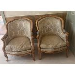 A pair of Louis style chairs with carved floral decoration