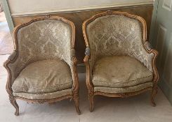 A pair of Louis style chairs with carved floral decoration