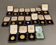 An Extensive Collection of gold medals many with additional enamel decoration from the prolific