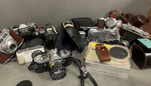 A large selection of vintage cameras, Pentax, Lumix, Sony, Petri Flex, Kowa