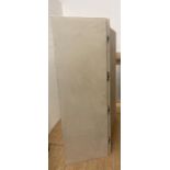 A large beige upholstered screen or room divider