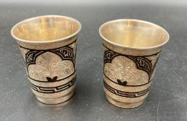 A pair of Russian Niello vodka cups marked 875 (77.7g)