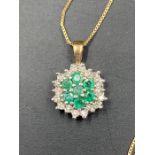 A emerald and diamond pendant on a fine 9ct gold chain. Approximate Total Weight 1.7g