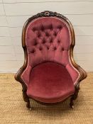 A Victorian Boudoir chair, button back and carved frame