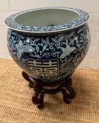 A blue and white fish bowl on stand decorated with birds and leaves (H65cm Dia37 including stand)