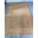 A contemporary beige rug 250cm x 150cm