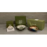 A selection of three boxed Christofle silver plated items to include a tea light holder, scallop