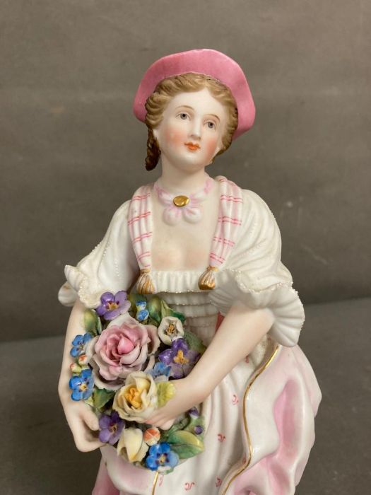 An 19th Century Bisque figure of a lady holding flowers - Image 2 of 5
