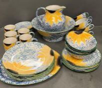 A Poole Pottery Vincent Sunflower dinner service to include: Six dinner plates, six side plates,