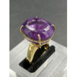 An 18ct yellow gold ring with substantial amethyst stone(21mm x 18mm) and approximate total ring