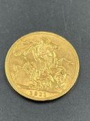 A 1911 gold sovereign coin