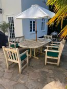 A teak garden dining set consisting of table, four chairs and two seater bench