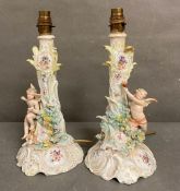 Two figural porcelain table lamps in the manner of Dresden with cherub and floral motif AF