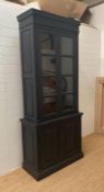 A black painted Georgian style two door glazed bookcase with two doors cupboard under (H224cm
