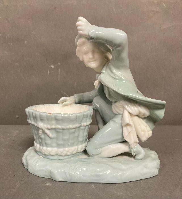 A late Victorian Mintons porcelain figure of a boy with a basket, marked to base - Image 3 of 4