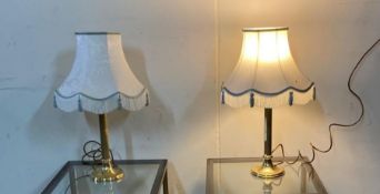 A pair of brass column table lamps