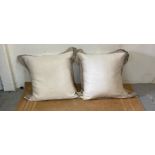 A pair of large beige linen cushions by Murielle Bolsseav
