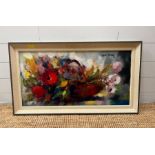 A floral still life on canvas signed top right 80cm x 40cm