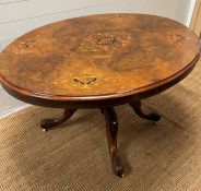 An oval centre table in rosewood with decorative floral inlay on castors (H74cm W130cm D100cm)