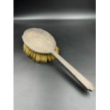 A silver backed dressing table brush, hallmarked for Birmingham 1938 by William Neale