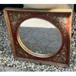 A small painted mirror with floral decorated to sides