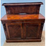 A Victorian walnut chiffonier with galleried top, and two drawers over two cupboards (H129cm