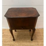 A mahogany sewing table on cabriole legs opening to a lined fitted interior (H60cm W46cm D33cm)