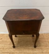 A mahogany sewing table on cabriole legs opening to a lined fitted interior (H60cm W46cm D33cm)