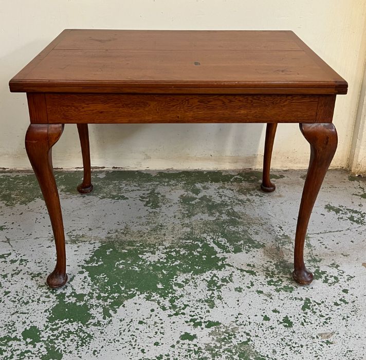 A fold over tea table with lined cutlery box to inside (H73cm W93cm D64cm)