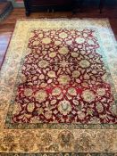 A red ground floral rug/carpet, made in India 318cm x 244cm