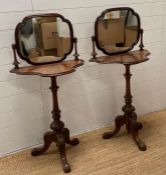 A pair of inlaid walnut dressing stands on carved central column ending on tripod scrolling feet (