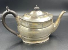 A silver teapot by Harrison Brothers & Howson, hallmarked for Sheffield 1936 and weighing
