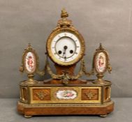 An eight day enamel mantle clock with gilt detail and swags, three hand painted enamel featuring