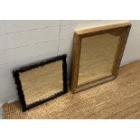 Two mirrors, one in a gilt frame and one black forest carved square mirror