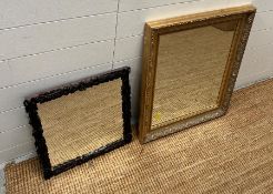 Two mirrors, one in a gilt frame and one black forest carved square mirror