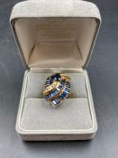 A contemporary Sapphire and diamond dress ring., two missing sapphires. Size K