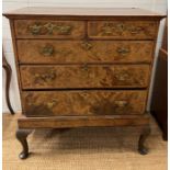 A Queen Anne style walnut chest on stand with feather banding to top and brass handles (H120cm