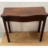 An 18th Century mahogany fold over card table (H74cm W92cm D45cm)