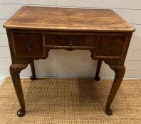 A low boy desk with cross banded top, three drawers and cabriole front legs (H72cm W72cm D47cm)