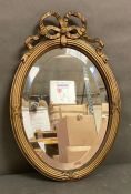 A gilt framed Rococo style hall mirror 36cm x 53cm