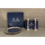 A pair of Mappin and Webb candle sticks and a boxed tray