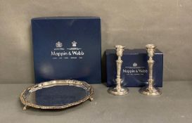 A pair of Mappin and Webb candle sticks and a boxed tray