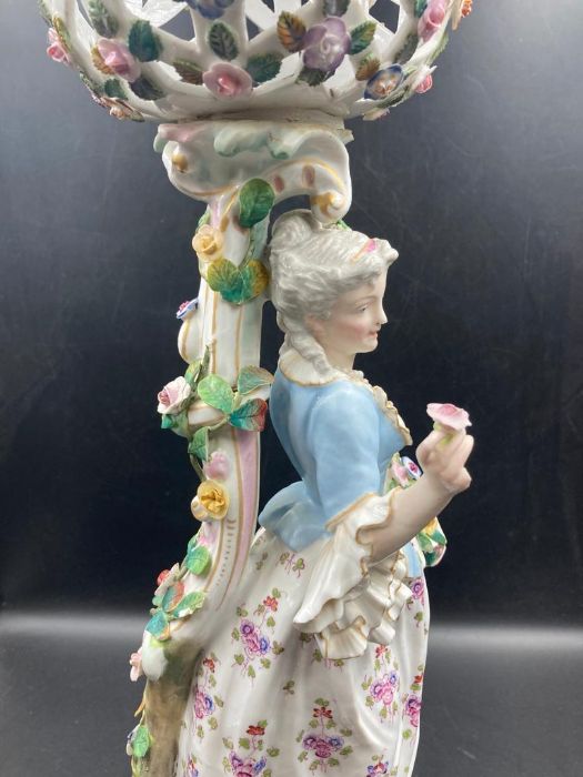 An 19th Century porcelain figural centrepiece depicting woman carrying flowers - Image 2 of 5