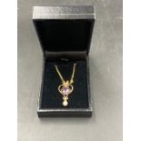 An amethyst and pearl pendant on a 9ct fine gold necklace (Approximate Total Weight 1.7g)