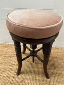 A regency style adjustable stool on turned legs