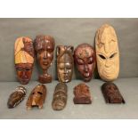A selection of wall hanging tribal masks