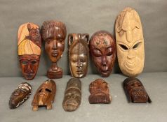 A selection of wall hanging tribal masks